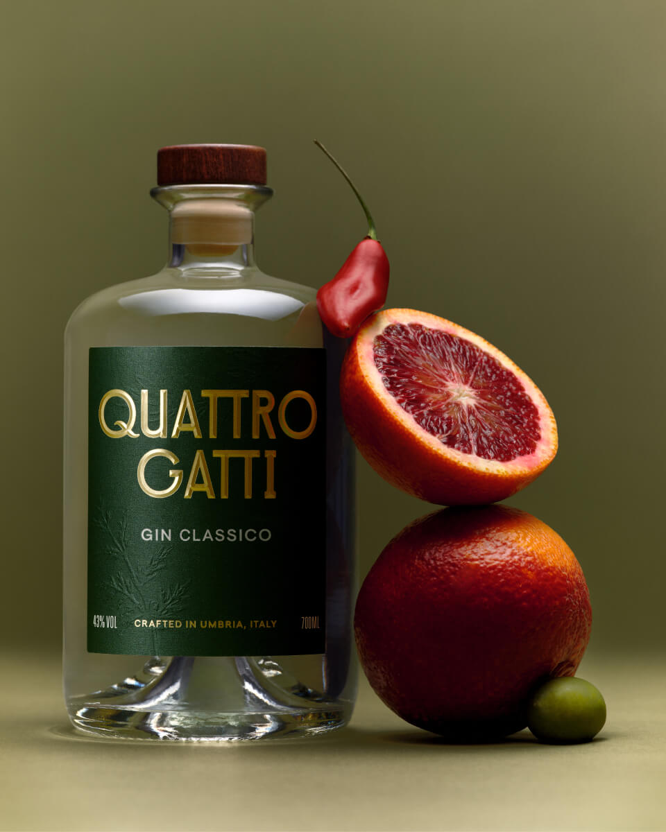 Quattro Gatti bottle next to fruit