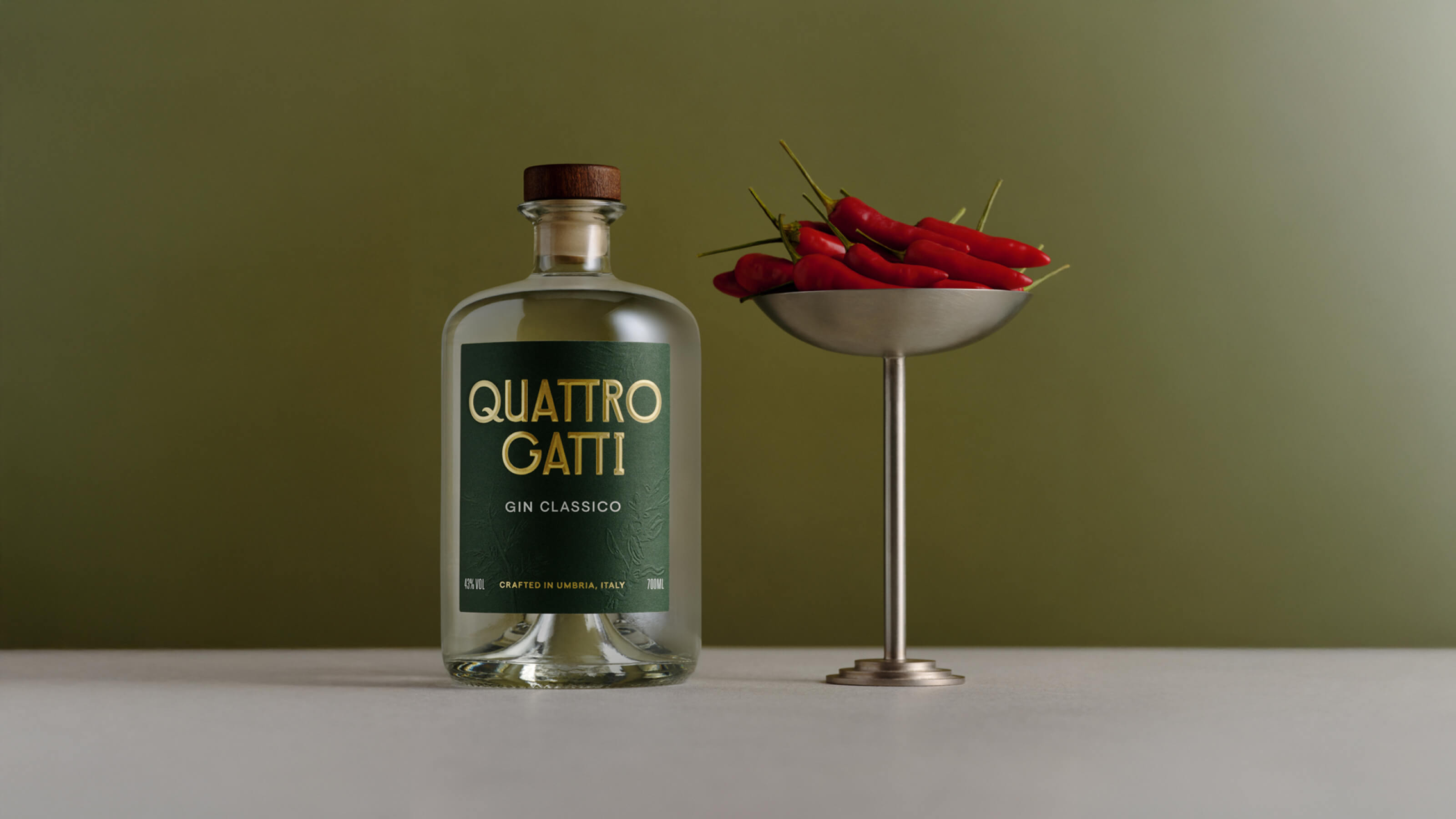Quattro Gatti bottle next to peppers